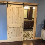 barndominium interior bathroom sliding door