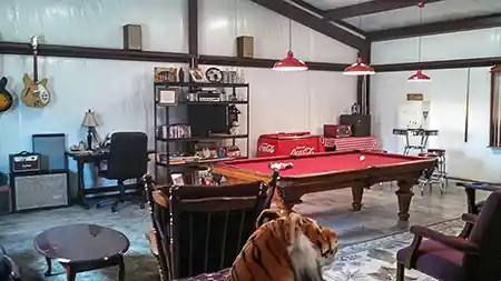 steel building man cave interior with pool table