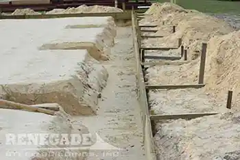 steel building foundation dug with piers