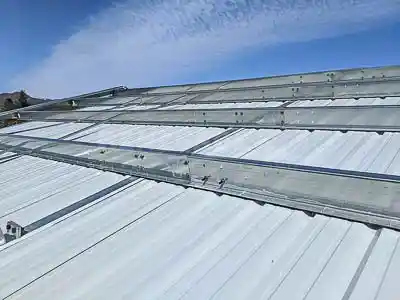 Steel Building Pool Cover construction interior liner panel installation from above